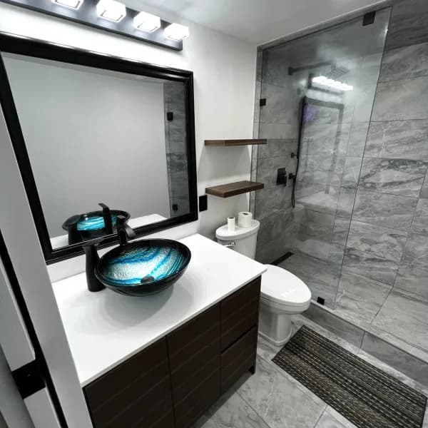 Before and after bathroom renovation, West End, Vancouver